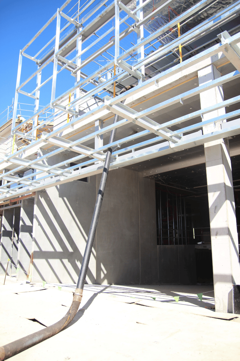 Look at the hose rom a blower truck going up one level of this scaffolding