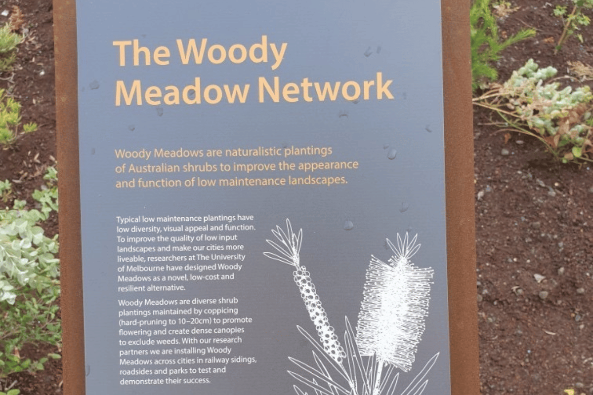 Informational plaque about the Woody Meadows Project